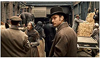 Sherlock Holmes (2009) 8 inch x 10 inch PHOTOGRAPH Jude Law Looking Over Left Shoulder in Brown Coat & Hat kn